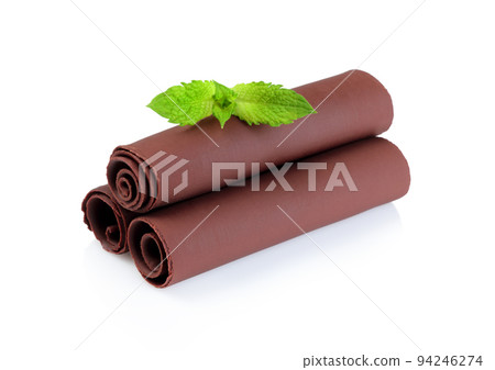 Chocolate Curls with Green Mint Leaves on white background 94246274