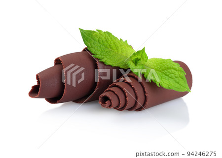Chocolate Curls with Green Mint Leaves on white background 94246275
