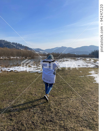 Woman in Hat and Jacket Spring Sky and Mountain Landscape 6 Woman in Hat and Jacket Spring Sky and Mountain Landscape 6 94247220