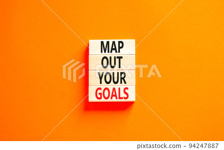 Support and map out your goals symbol. Concept words Map out your goals on wooden blocks on a beautiful orange table orange background. Business, support and map out your goals concept Support and map out your goals symbol. Concept words Map out your goals on wooden blocks on a beautiful orange table orange background. Business, support and map out your goals concept 94247887