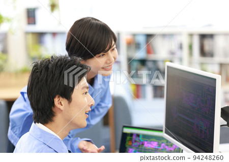 A male designer receiving a lecture on CAD work from seniors_1 94248260
