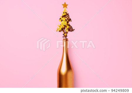 Champagne bottle with confetti flat lay top view Champagne bottle with confetti flat lay top view 94249809