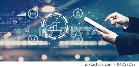 Business growth analysis with businessman using a tablet 94252252