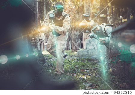People in full gear playing paintball People in full gear playing paintball 94252510