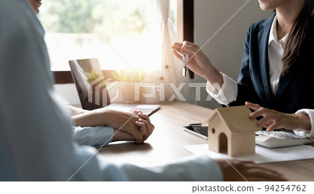 Young couple in love starting family life, applying for mortgage to buy accommodation, purchasing, renting apartment, meeting with real estate agent. 94254762
