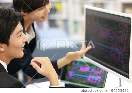 Male designer checking drawings while looking at CAD with seniors_1 94255421