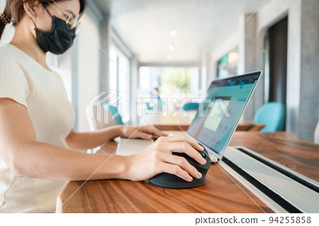 woman hand using computer ergonomic mouse, prevention wrist pain because working long time. De Quervain s tenosynovitis, Intersection Symptom, Carpal Tunnel Syndrome or Office syndrome concept 94255858