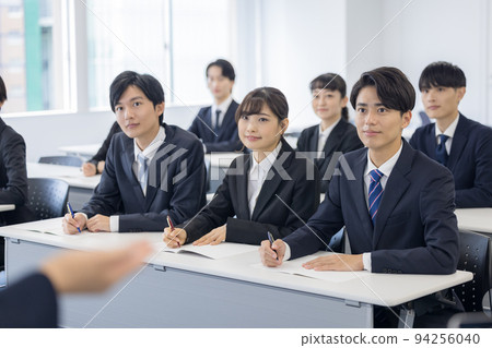 Seminar Young men and women in suits Seminar Young men and women in suits 94256040