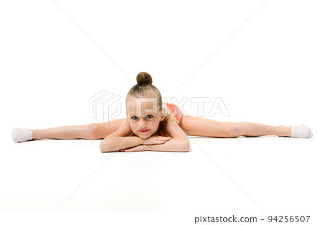 Small female gymnast lay in split down Small female gymnast lay in split down 94256507