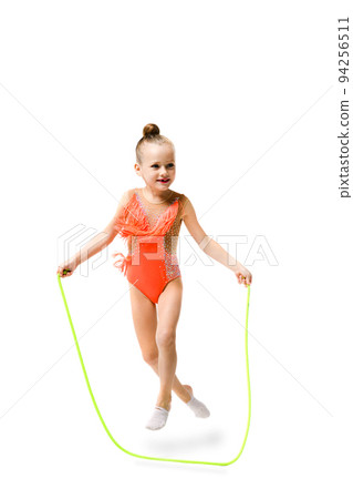 Sporty gymnast pretty child jump with rope 94256511
