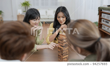Holiday concept of 4k Resolution. Group of Asian female friends playing games together at home. Fun and exciting leisure activities. Holiday concept of 4k Resolution. Group of Asian female friends playing games together at home. Fun and exciting leisure activities. 94257693
