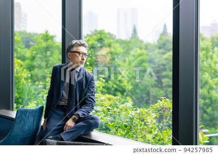 Executive man looking out in the office 94257985