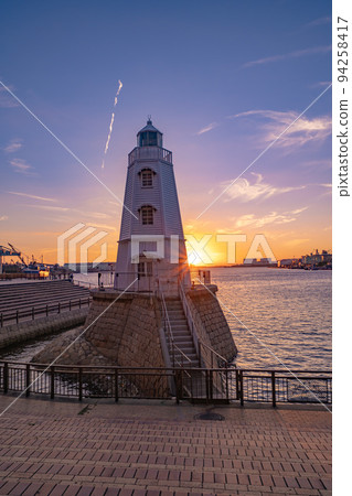 Former Sakai lighthouse illuminated by the setting sun 94258417