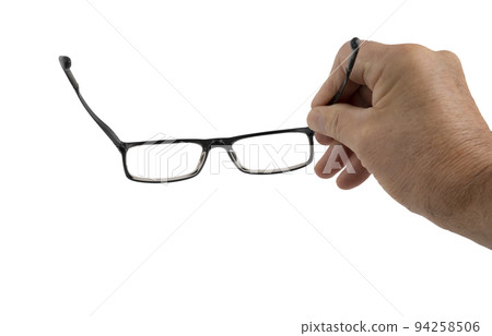 a pair of eyeglasses in a man's hand a pair of eyeglasses in a man's hand 94258506