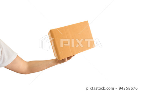 Delivery man hand holding parcel cardboard box isolated on white background Delivery man hand holding parcel cardboard box isolated on white background 94258676