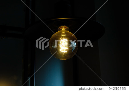 Retro-style light bulb glows in the dark Retro-style light bulb glows in the dark 94259363