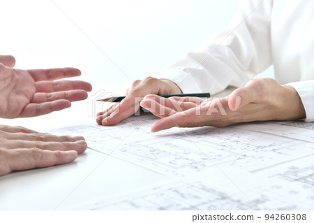 Person's hand discussing design 94260308