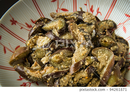Stir-fried eggplant in miso, served on a plate with a Japanese pattern Stir-fried eggplant in miso, served on a plate with a Japanese pattern 94261871