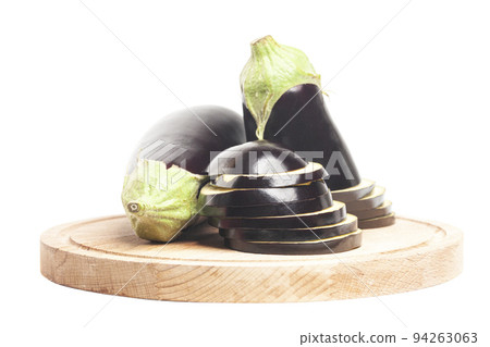 Sliced eggplant on wooden cutting board Sliced eggplant on wooden cutting board 94263063