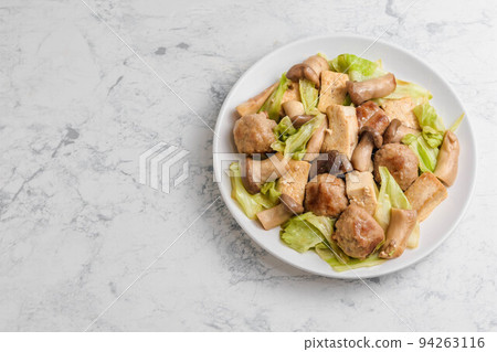 Stir-fried meatballs and cabbage with oyster Stir-fried meatballs and cabbage with oyster 94263116