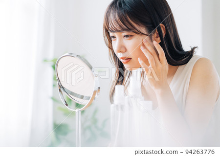 Woman checking your skin Woman checking your skin 94263776