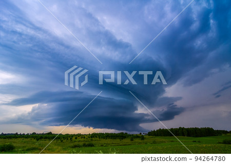 Storm clouds over field, storm cell, extreme weather, dangerous storm Storm clouds over field, storm cell, extreme weather, dangerous storm 94264780
