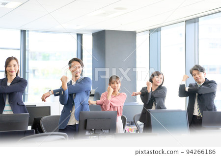 Business person stretching in the office Business person stretching in the office 94266186