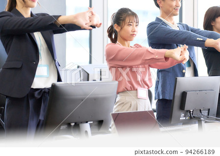 Business person stretching in the office 94266189