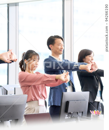 Business person stretching in the office 94266190