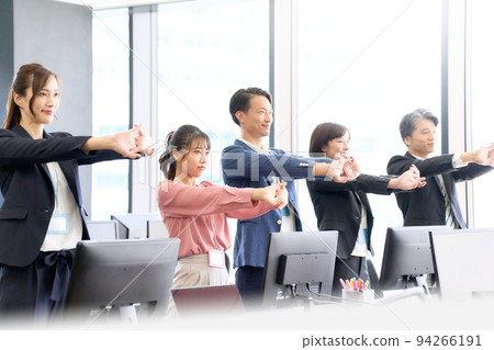 Business person stretching in the office 94266191