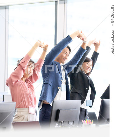 Business person stretching in the office 94266195