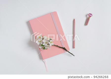 Modern flat lay, hospital, pink notepad or planner with a pen and apple flowers on a white table. Best for social media, blogging Modern flat lay, hospital, pink notepad or planner with a pen and apple flowers on a white table. Best for social media, blogging 94266268