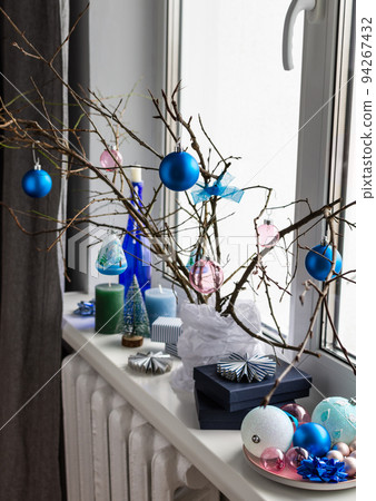Branches with blue and pink Christmas balls 94267432