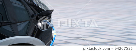 Electromobile charging plug is inserted into vehicle charging socket. Electromobile charging plug is inserted into vehicle charging socket. 94267555