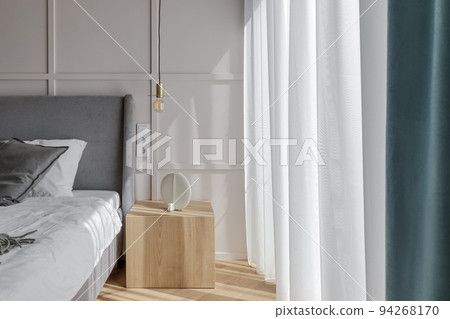 Modern minimalist bedroom interior design with grey furniture, oak floor in Scandinavian style.  Aesthetic simple interior design concept. 94268170