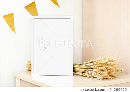 white frame with copy space and barley spiklets on a table. autumn sale or inspirational text mockup. seasonal party, celebration of harvesting, country minimal style. white frame with copy space and barley spiklets on a table. autumn sale or inspirational text mockup. seasonal party, celebration of harvesting, country minimal style. 94269613