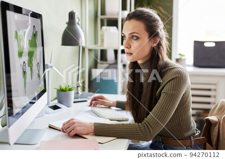 Businesswoman working on computer at office Businesswoman working on computer at office 94270112