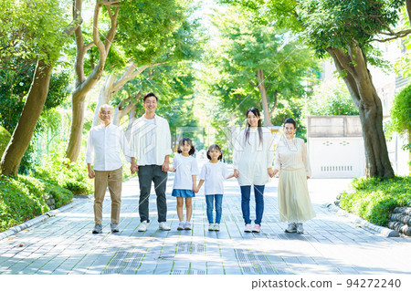 Three generations family connecting hands 94272240