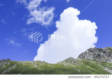 Images of thunderheads and summer mountains Climbing 94274727