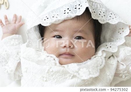 Baby in a baby dress Baby in a baby dress 94275302