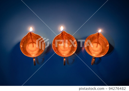 Happy Diwali. Diya on blue background. Traditional oil lamp. Celebrating festival of light. 94276482