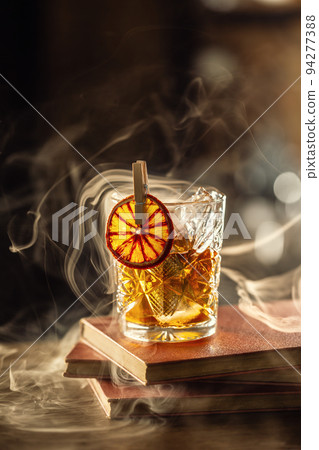 Glass cup with Old Fashioned cocktail in retro style Glass cup with Old Fashioned cocktail in retro style 94277388