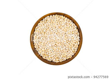 Top view or flat lay of fresh raw barley in wooden bowl. Top view or flat lay of fresh raw barley in wooden bowl. 94277569
