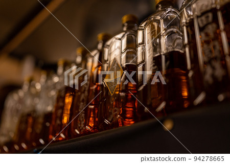 whiskey bottle in tavern 94278665