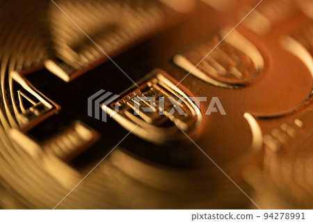 top view extreme macro closeup of crypto bitcoin golden coin logo 94278991