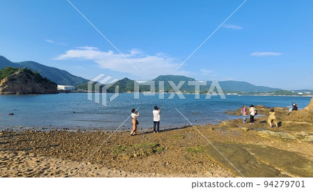 A couple standing on Shodoshima A couple standing on Shodoshima 94279701
