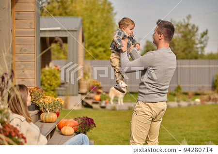 Family of three spending time together in the countryside 94280714
