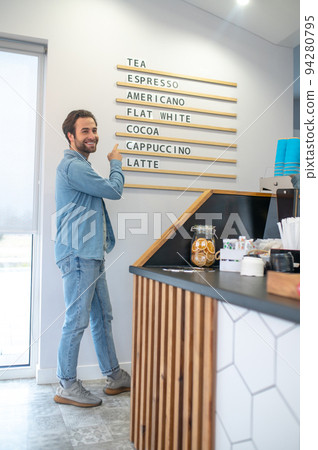 Cafe owner thinking over new idea for the menu Cafe owner thinking over new idea for the menu 94280795