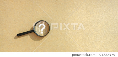 Magnifying glass with a question mark. Looking for an answer. Search and analysis, analytics and study. Pay attention to details and problems. Find something. Journalistic investigations and research 94282579
