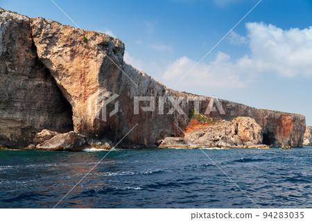 Natural stone arch. Coastal landscape of Comino, Malta 94283035